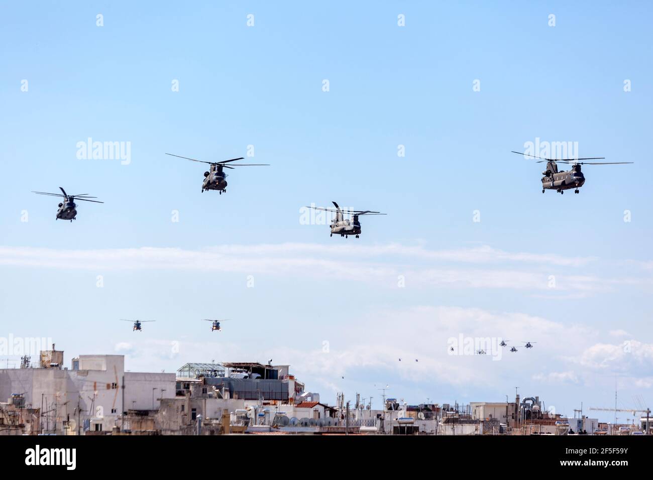 Boeing CH-47 Chinook helicopters flying in formation above Athens, Greece, during the military parade for the 200 years of the Greek Independence War Stock Photo