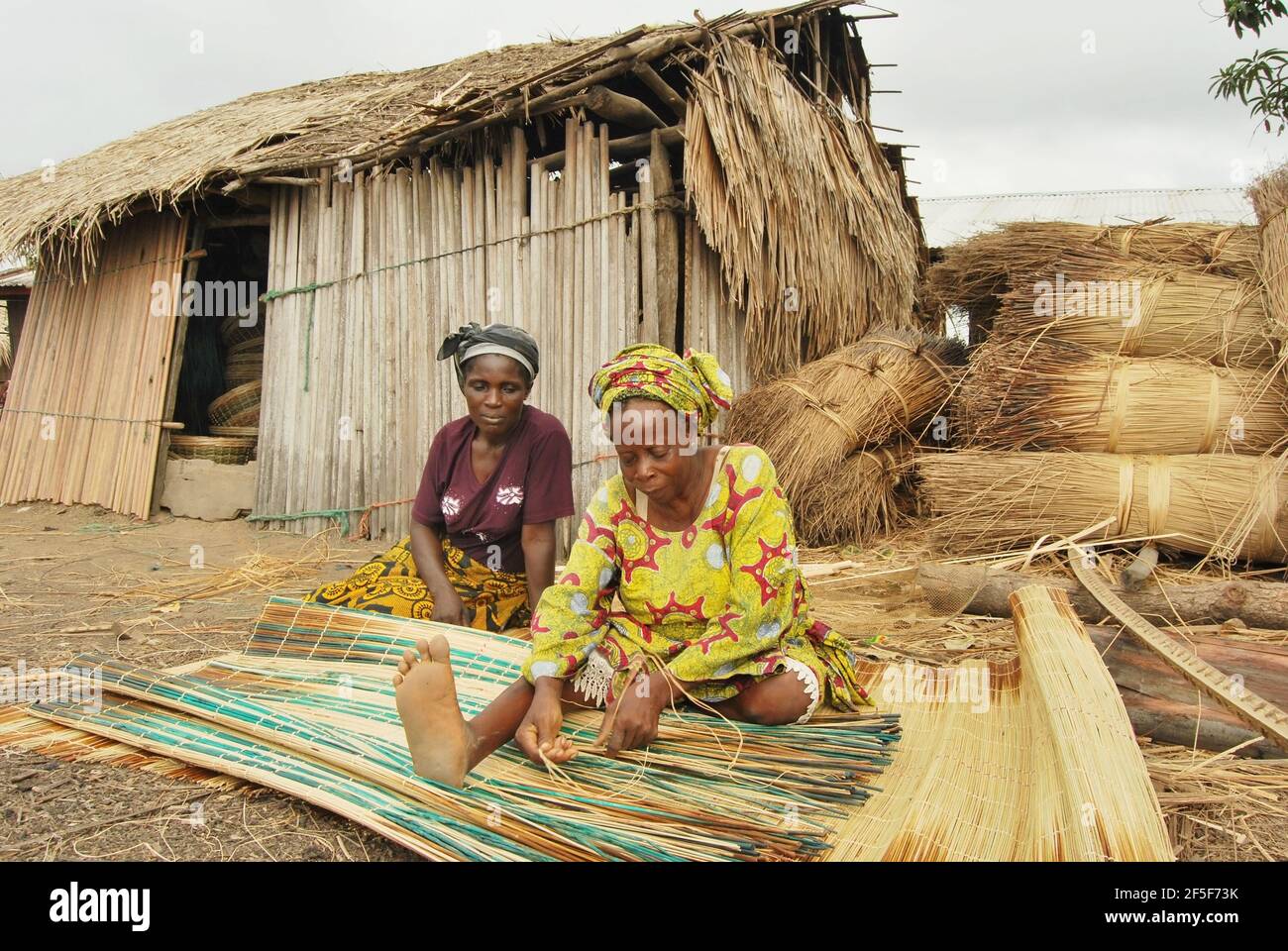 Nigerian women weaving mat in the outskirt of Ondo State, Nigeria. Stock Photo