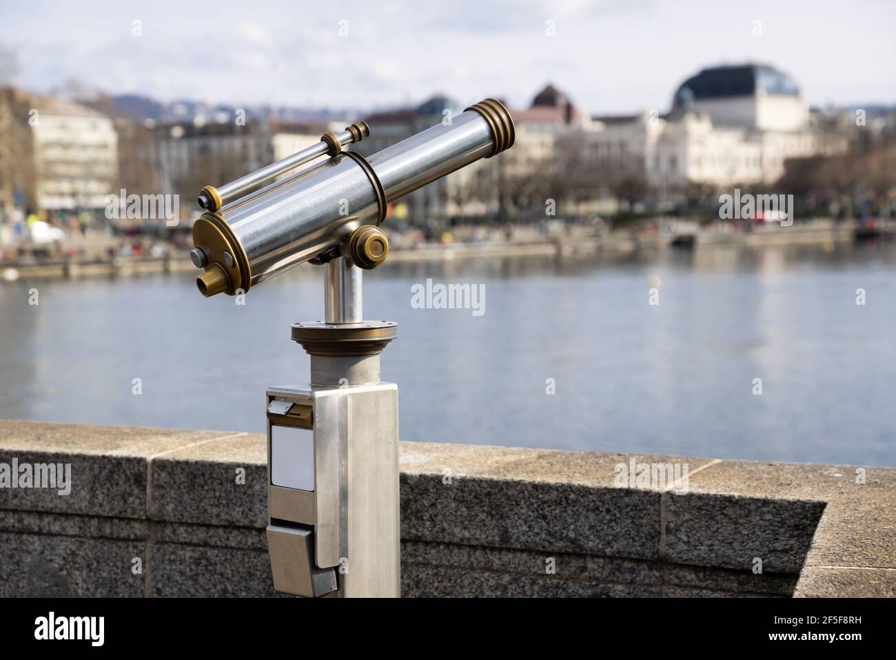 antiques old interesting observation platform binoculars for city and landscape sightseeing made of metal and golden copper, side view, by day, withou Stock Photo