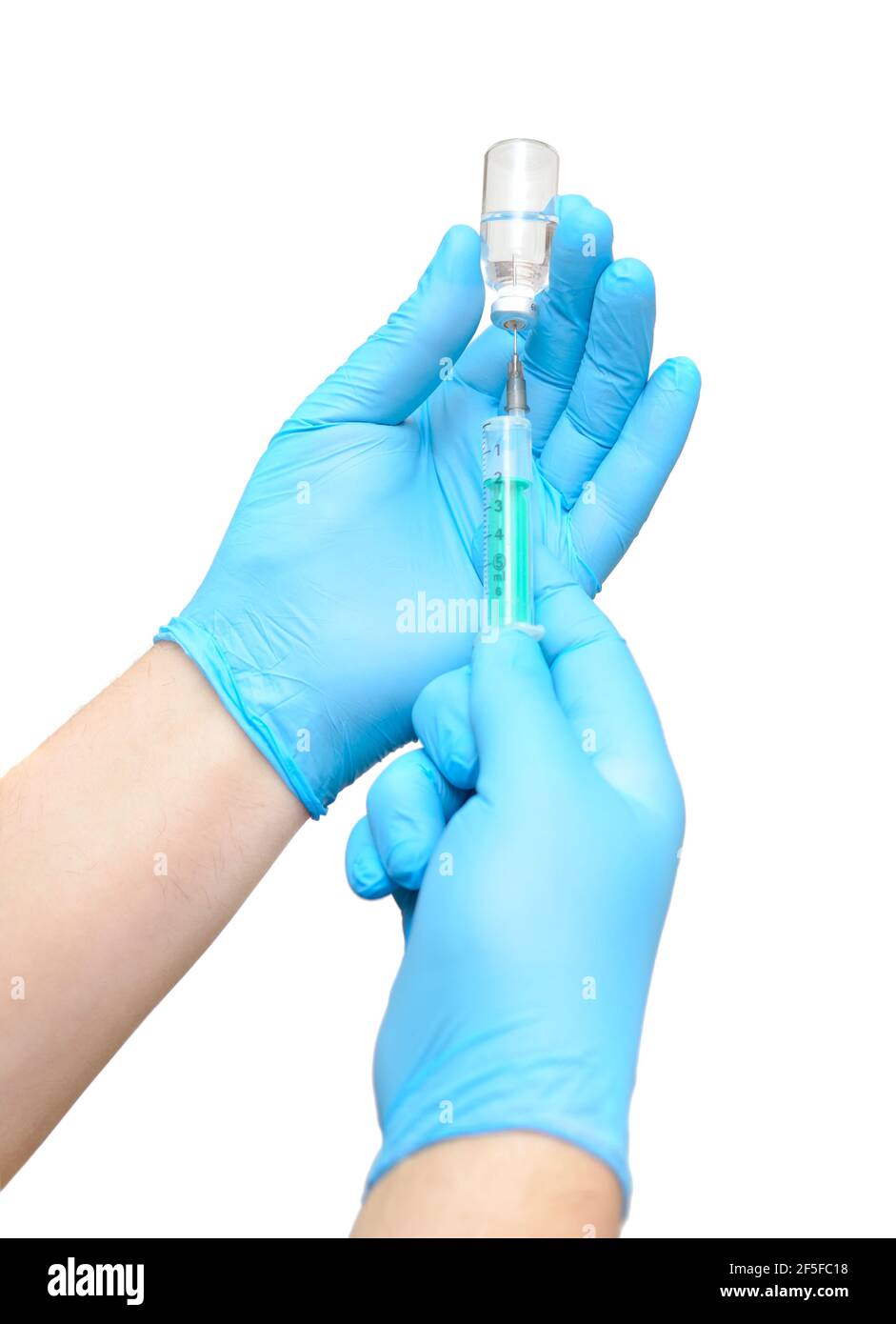 Taking drugs or vaccines into a syringe. Stock Photo