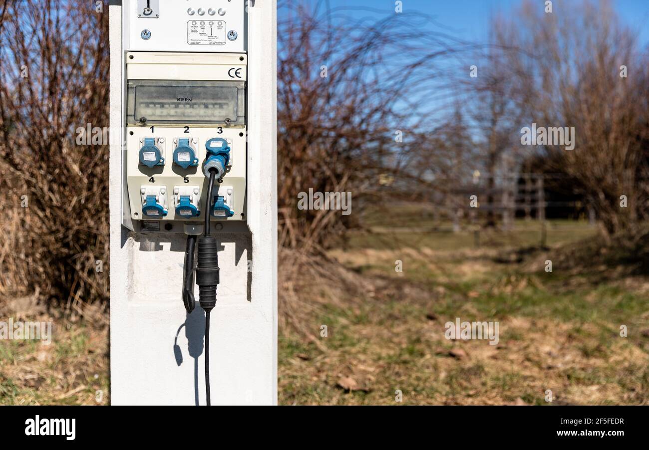 Erding, Germany - February 27, 2019: Electric power station with display of sockets and fuses on a camp site Stock Photo