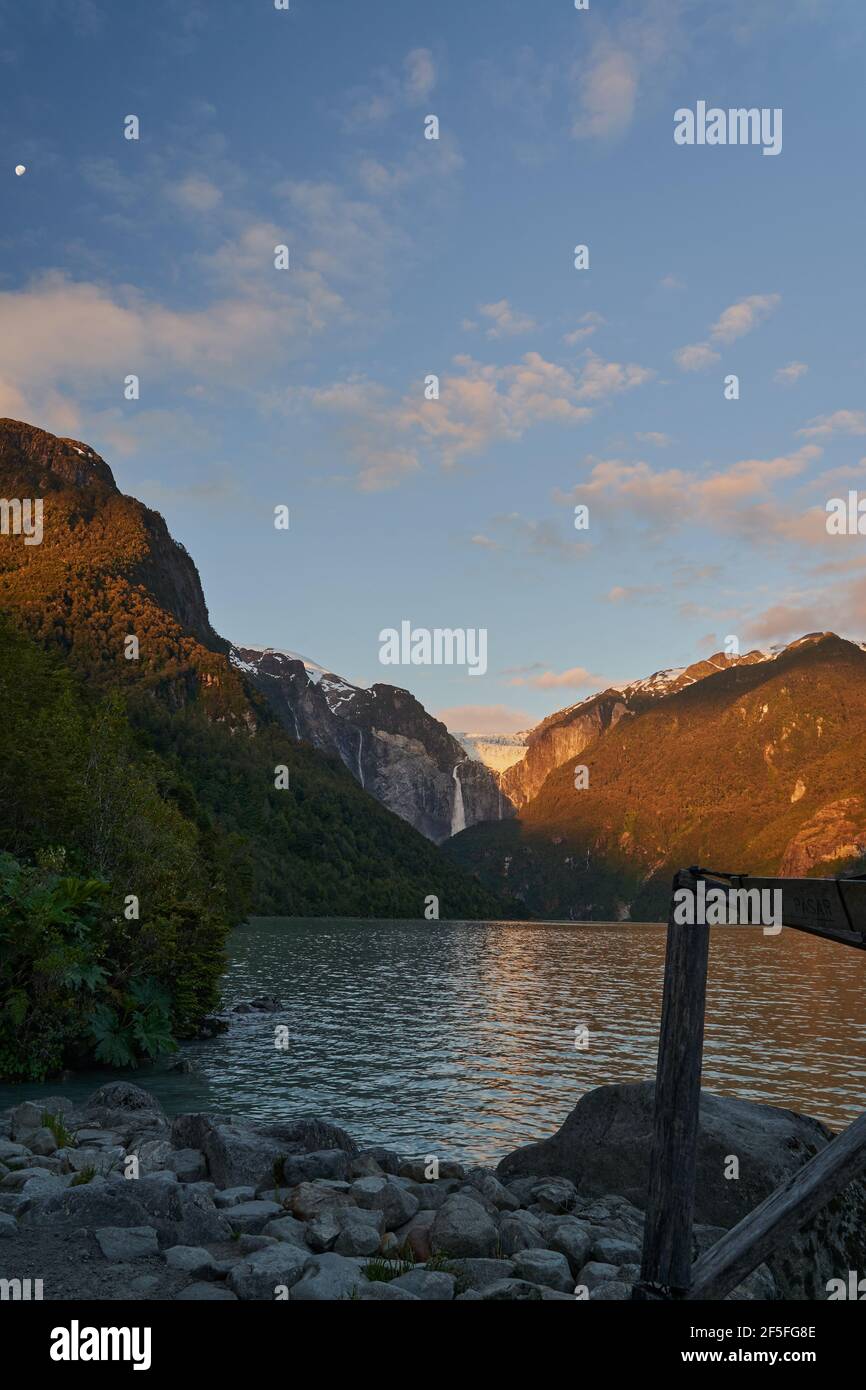 Ventisquero Colgante, a hanging Glacier with waterfall and lake in ...