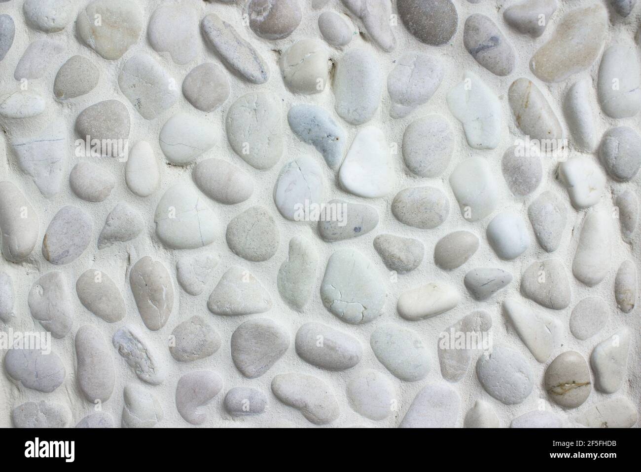 White small stones texture background, cladding tiled bathroom walls Stock Photo