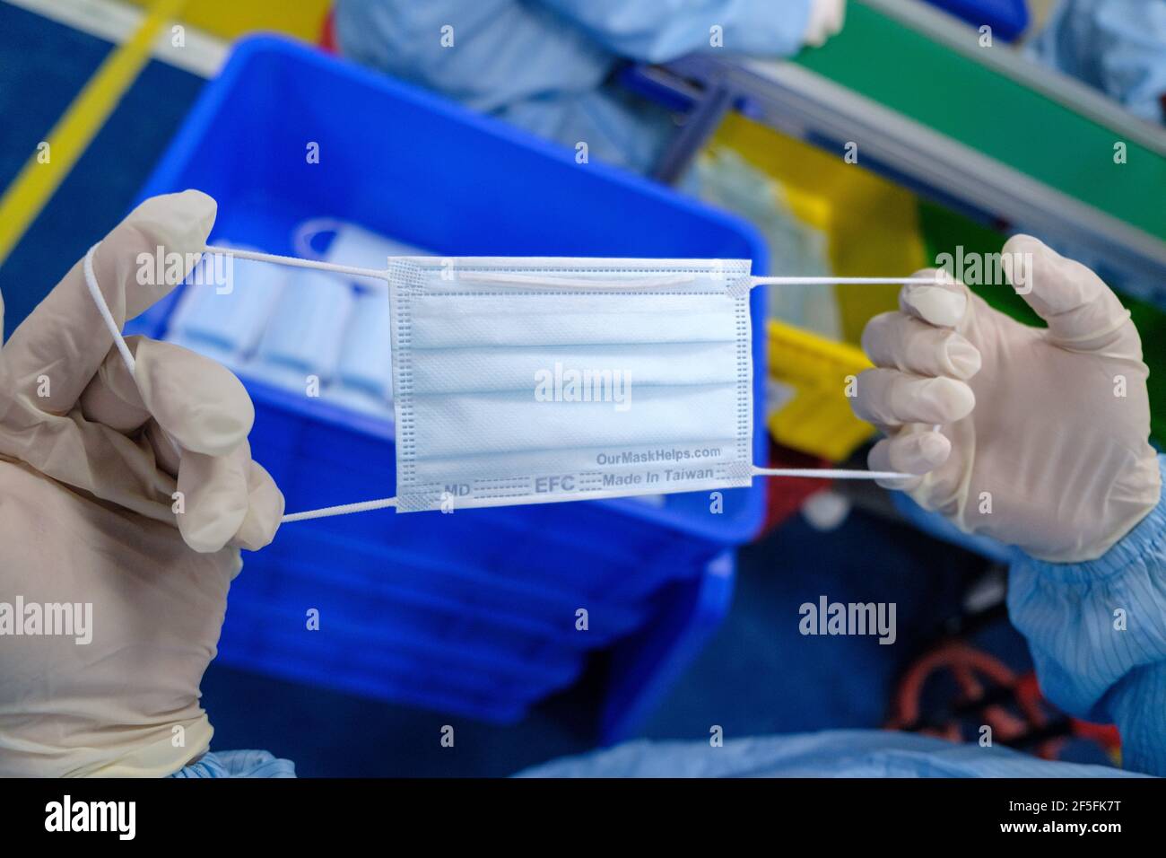 Taoyuan, Taiwan. 24th Mar, 2021. An enfant mask sown in Easy Field Corporation (EFC) protective mask factory in Taoyuan. Credit: SOPA Images Limited/Alamy Live News Stock Photo