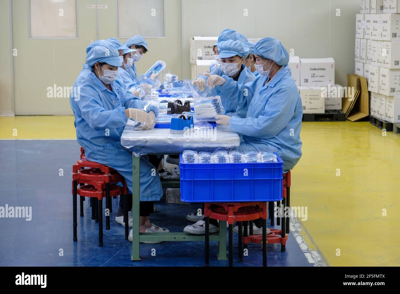 Workers sorting masks in the Easy Field Corporation (EFC) protective mask factory in Taoyuan. (Photo by Walid Berrazeg / SOPA Images/Sipa USA) Stock Photo