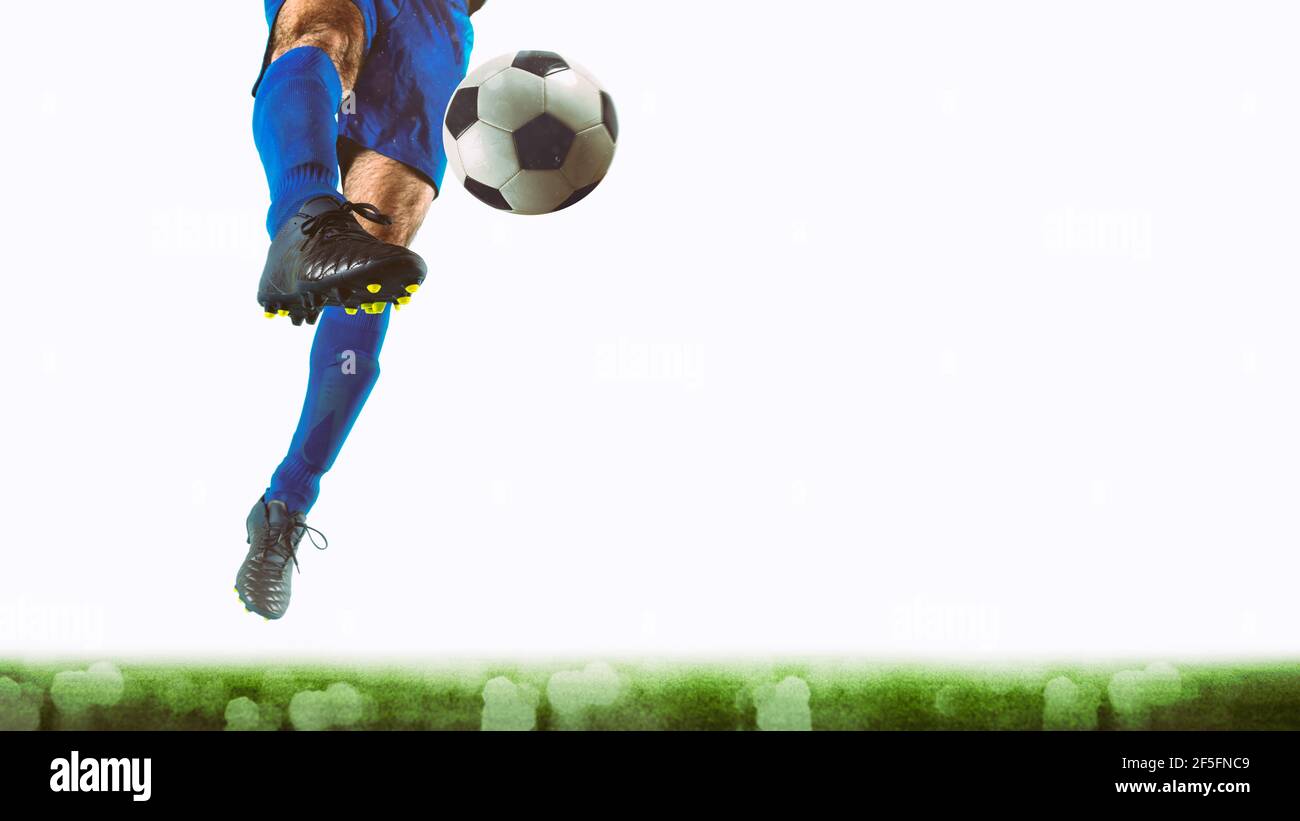 Close up of a striker who kicks the ball to make goals on a white background Stock Photo