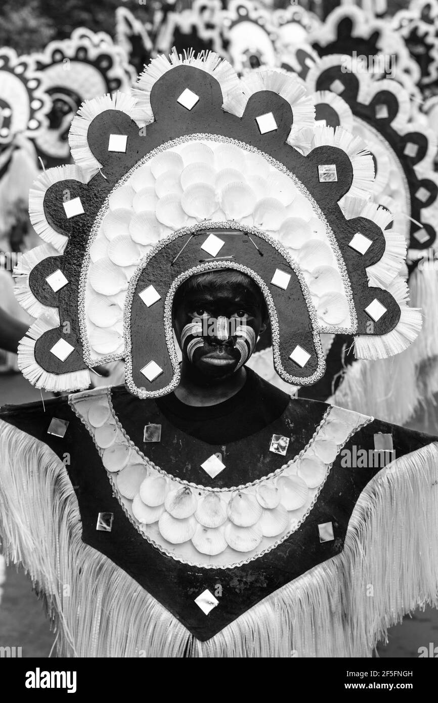 Young People In Colourful Costume Take Part In A Street Procession During The Ati-Atihan Festival, Kalibo, Panay Island, The Philippines. Stock Photo