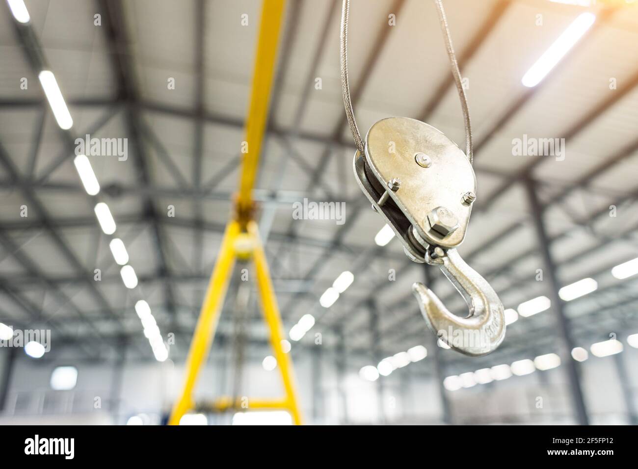 Close up Swivel electric crane hook for overhead crane in the workshop or factory Stock Photo