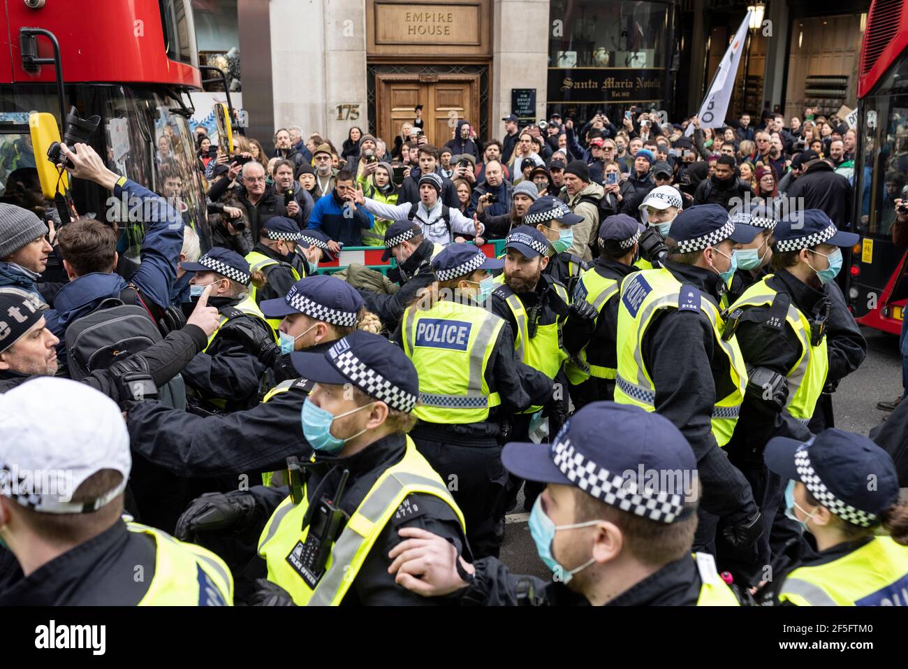 Anti-lockdown and anti Covid-19 vaccination protest, London, 20 March 2021. Police clashing with protesters. Stock Photo