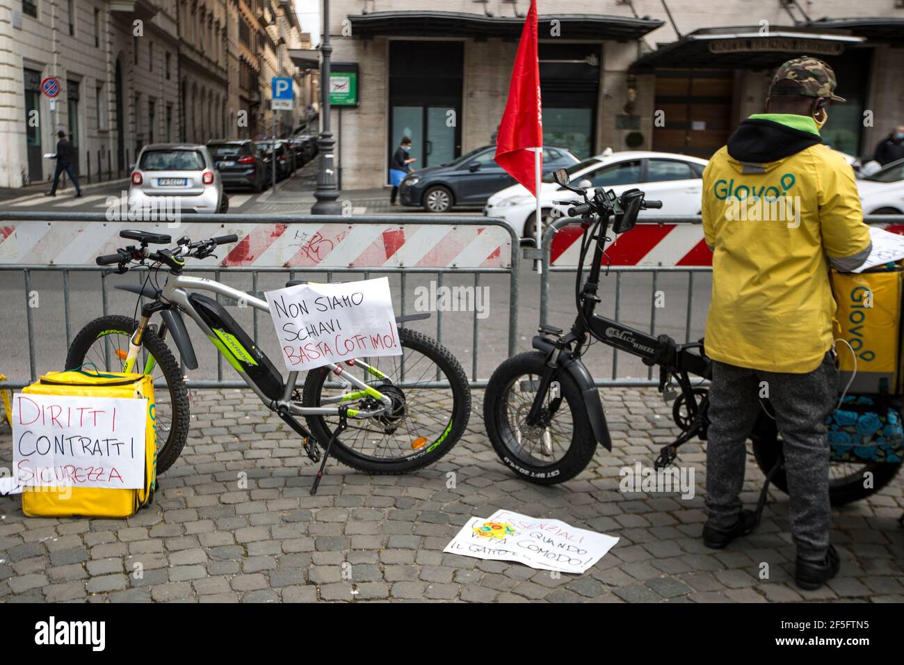 Rome, Italy. 26th Mar, 2021. Strike held in Rome by food delivery riders who call the Internet food delivery platforms to provide contracts, better working condition and better payment. The strike has taking place in about 30 cities across Italy. Credit: LSF Photo/Alamy Live News Stock Photo