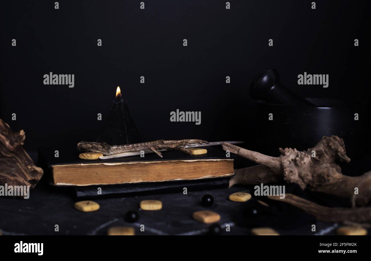 Still life with burning candles and pentagram circle background. Black ...