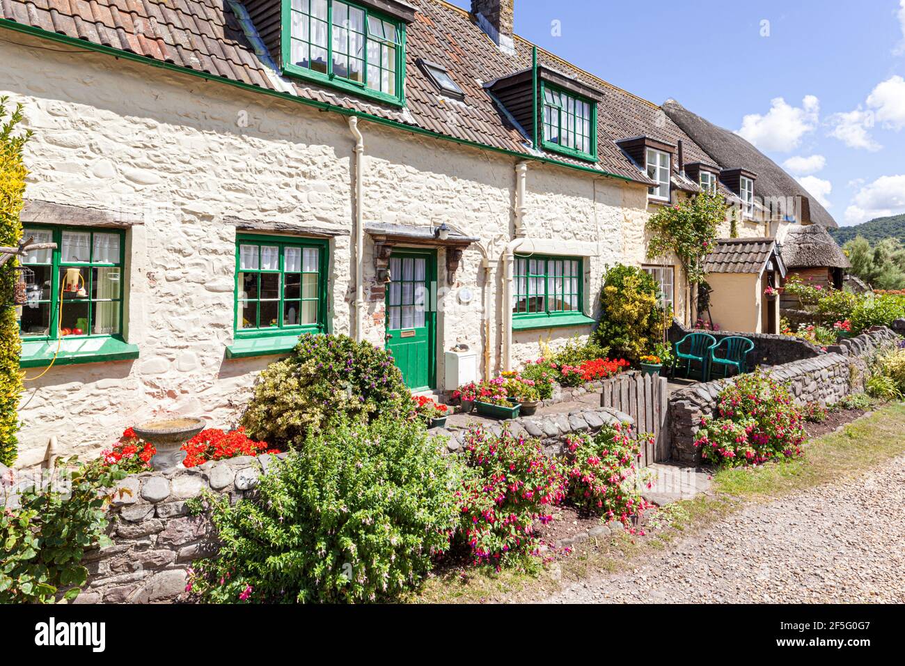 Traditional cottages beside the harbour on the edge of Exmoor at Porlock Weir, Somerset UK Stock Photo