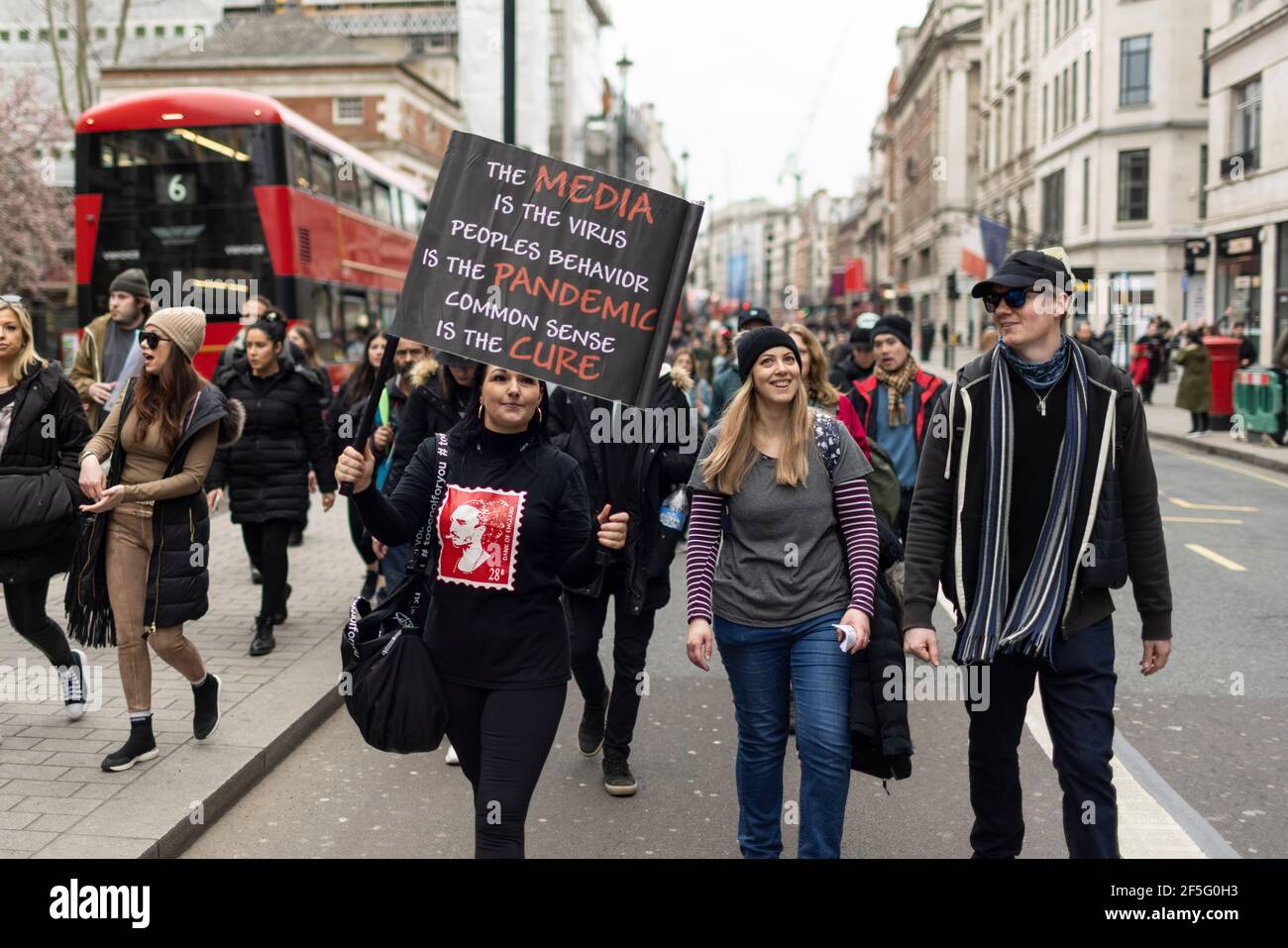 Anti-lockdown and anti Covid-19 vaccination protest, London, 20 March 2021. Marching protesters. Stock Photo