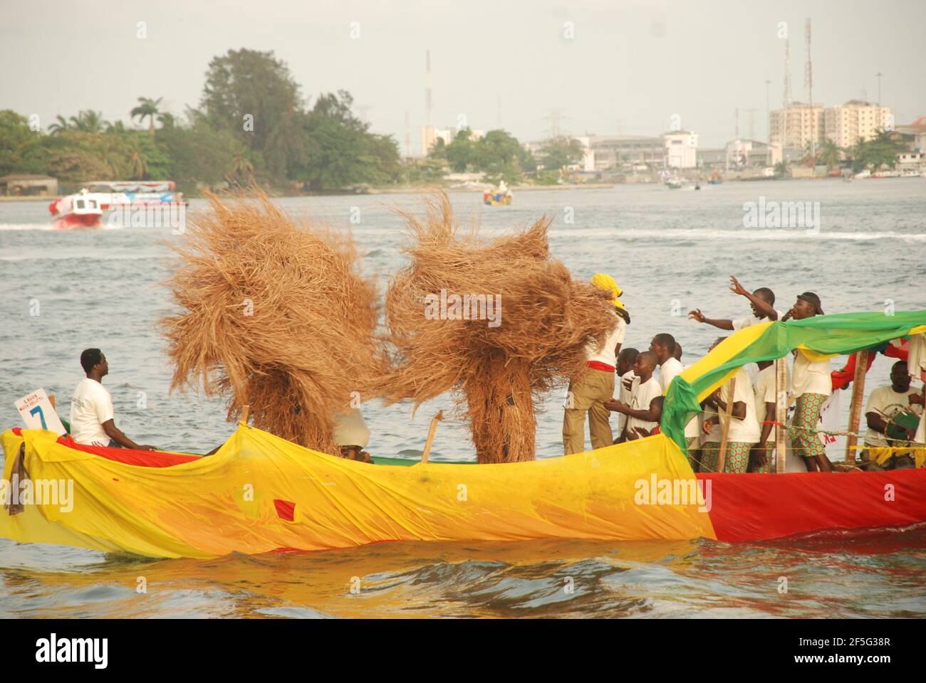 Zengbeto Masquerades dancing on Lagos lagoon. Stock Photo