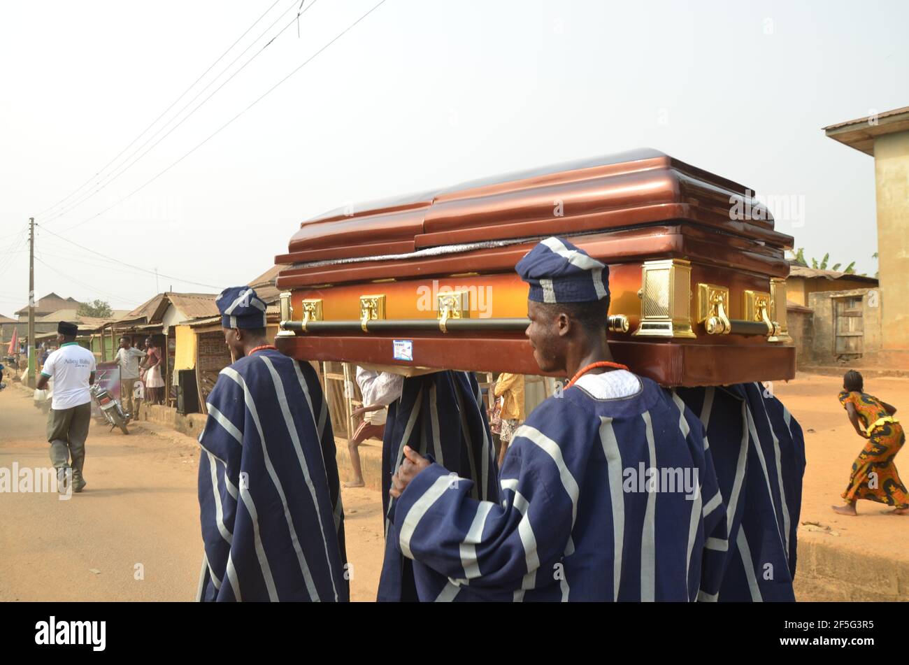Pallbearer displaying in Yoruba costume during the burial ceremony of a chief in Yoruba land. Stock Photo