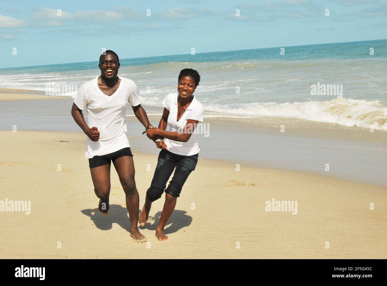 Young lovers playing at Lagos Beach, Nigeria. Stock Photo