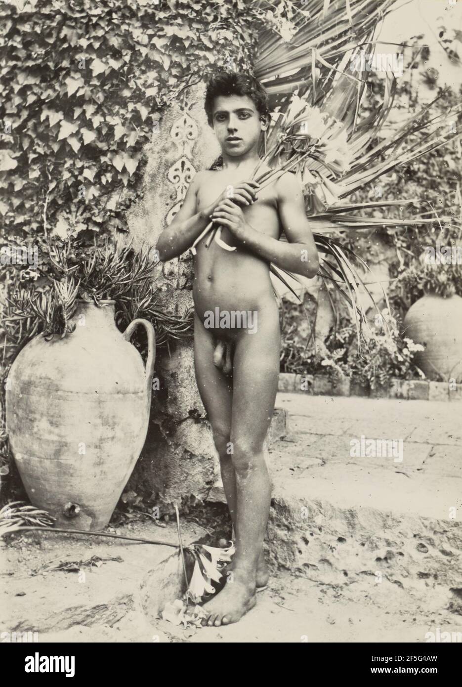 Boy in garden. Baron Wilhelm von Gloeden (German, 1856 - 1931) Stock Photo