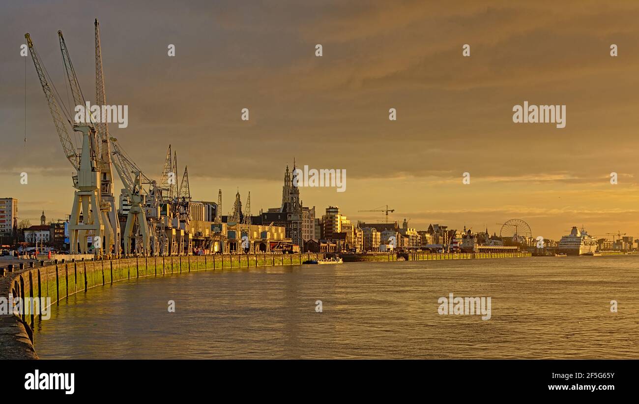 Quay along river Scheldt in the port of Antwerp, with old industrial ...