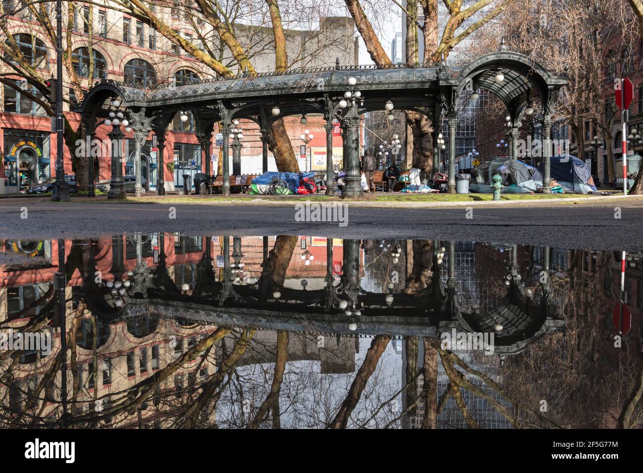 Seattle, USA. 22nd Mar, 2021. The historic pergola and homeless tents