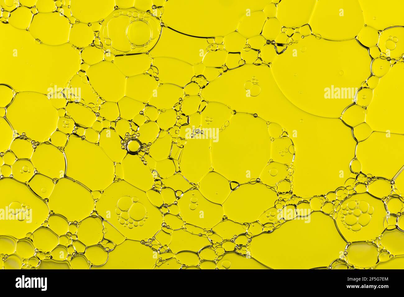 Oil and Water Abstract In Yellow Stock Photo