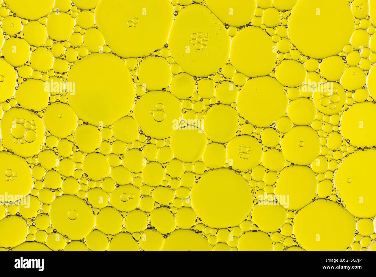 Oil and Water Abstract In Yellow Stock Photo