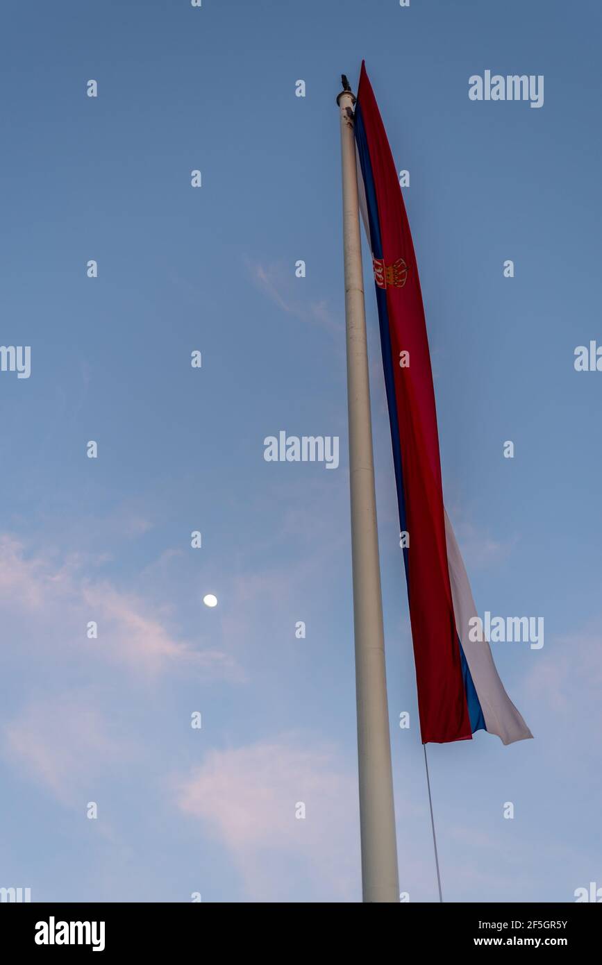 Huge flag of Serbia in front of the National Assembly of the Republic of Serbia, Parliament of Serbia in Belgrade, Serbia Stock Photo