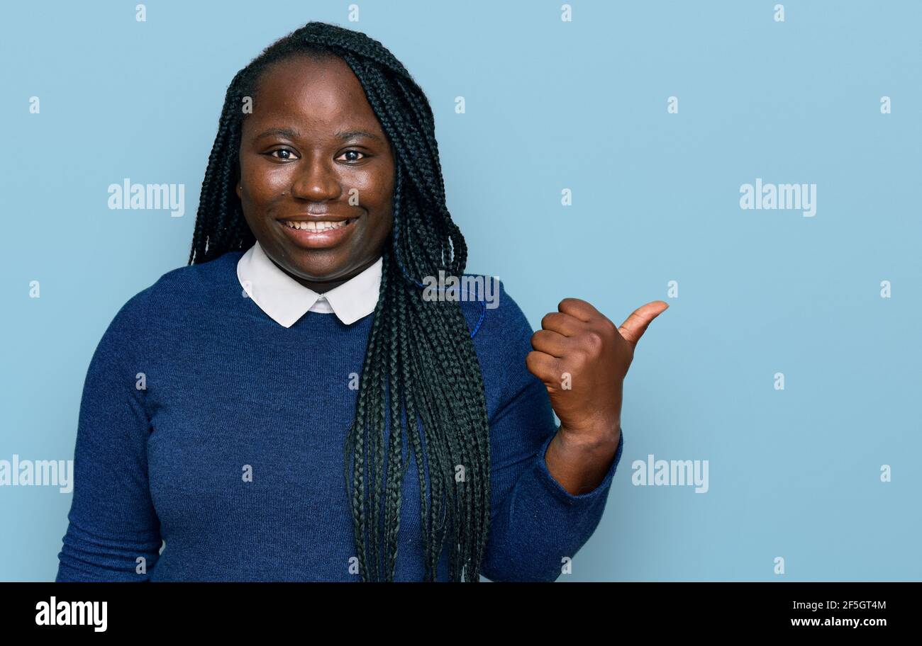 Young black woman with braids wearing casual clothes smiling with happy ...