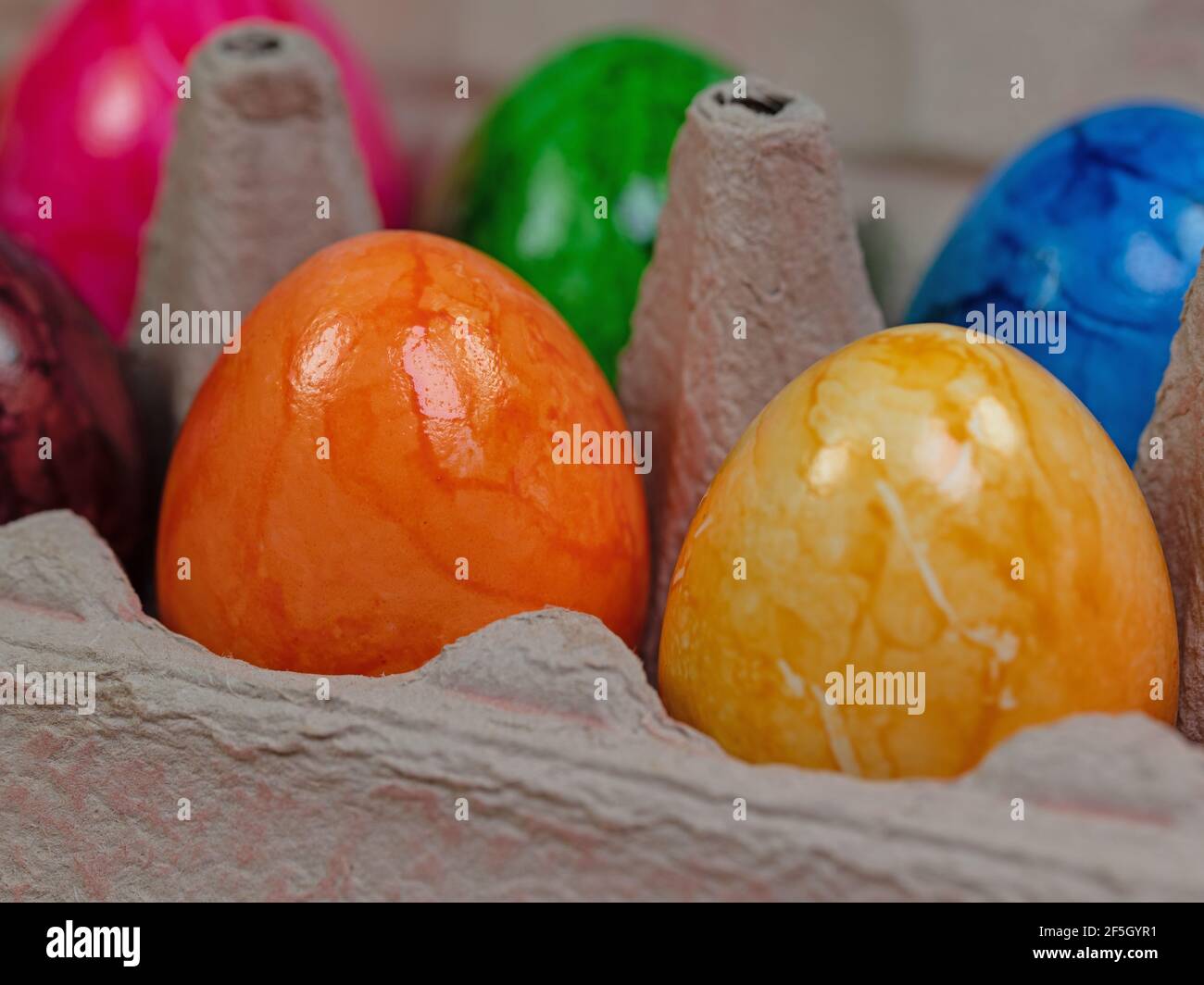 Colored chicken eggs in the package Stock Photo