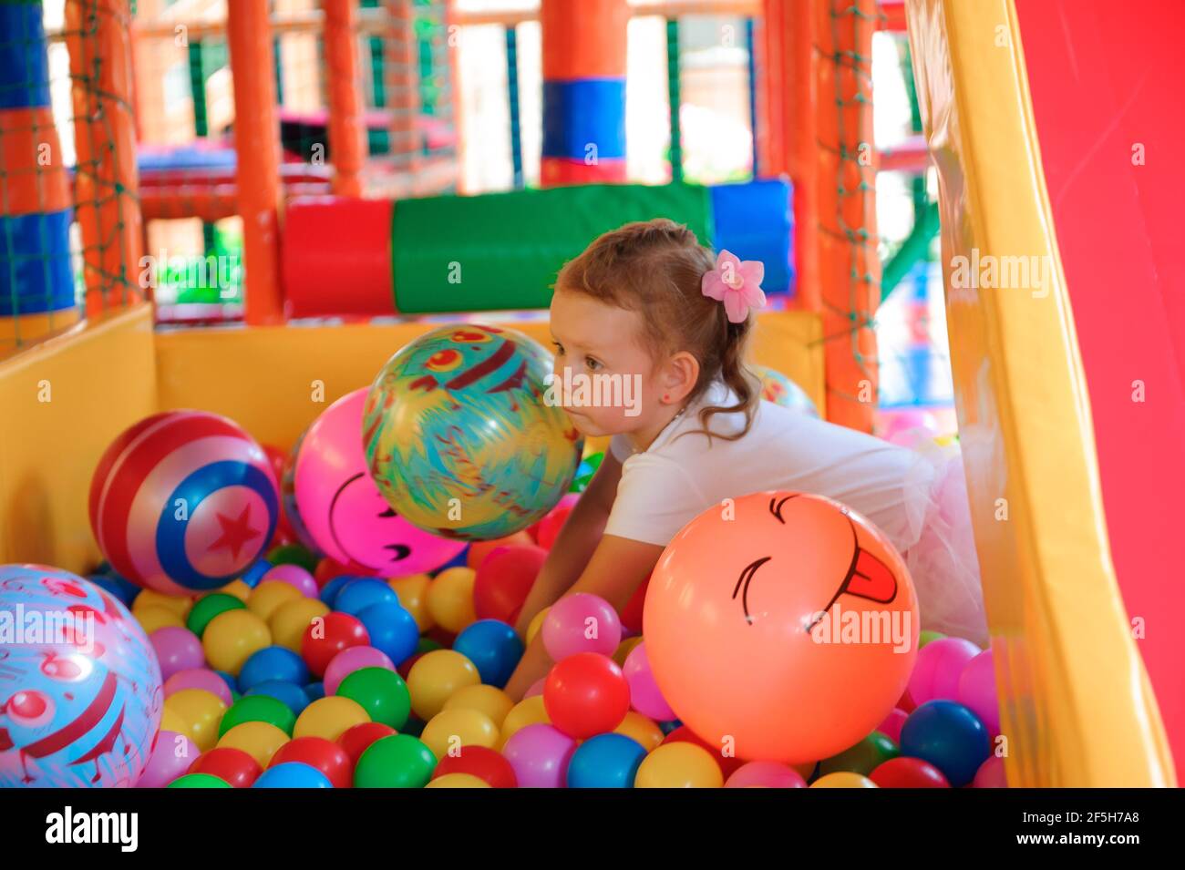 Indoor playground with colorful plastic balls for children. Stock Photo