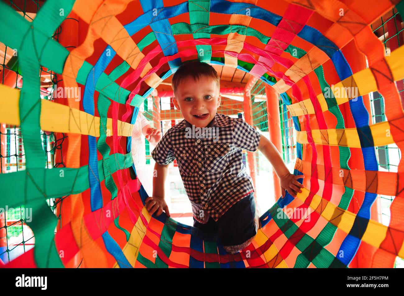 Boy playing on the playground, in the children's maze. Children's ...