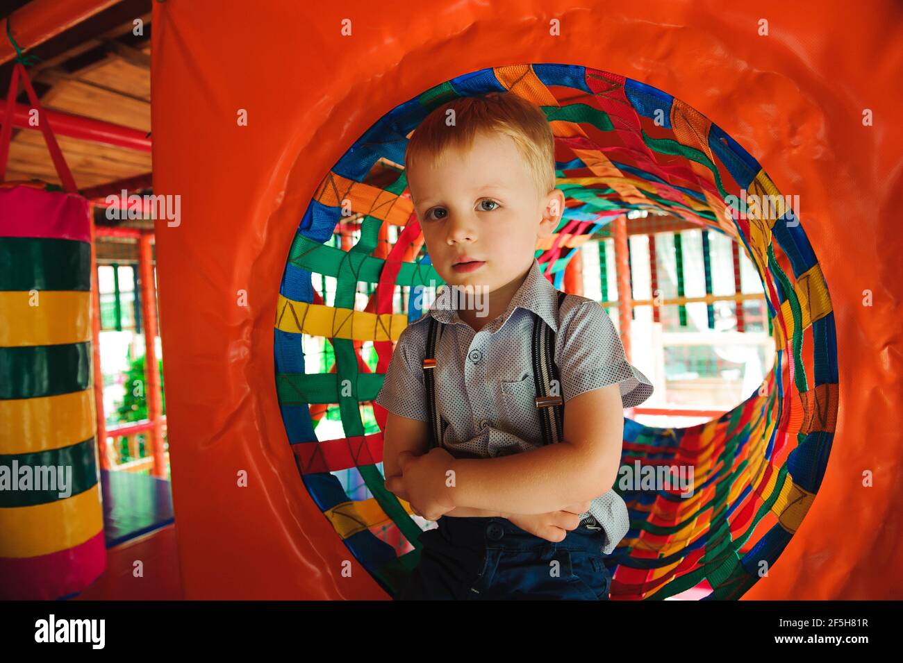 Boy playing on the playground, in the children's maze. Children's ...