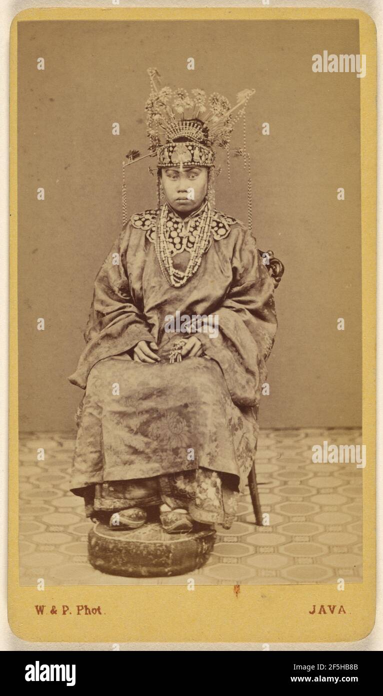 Javanese woman wearing an ornate headdress, seated. Woodbury & Page (British, active 1857 - 1908) Stock Photo