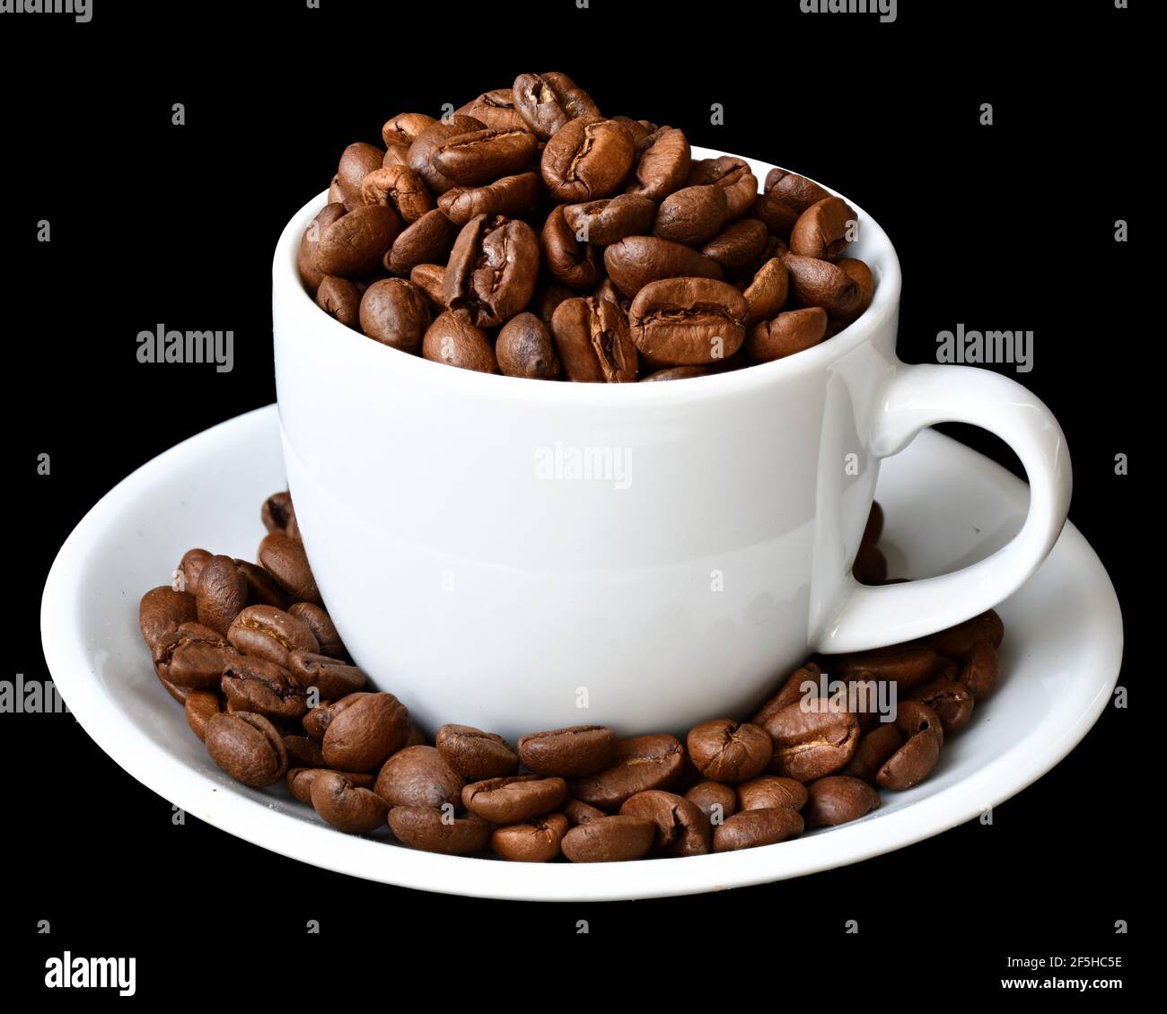 Cup of hot coffee with a scattering of coffee beans isolated Stock Photo