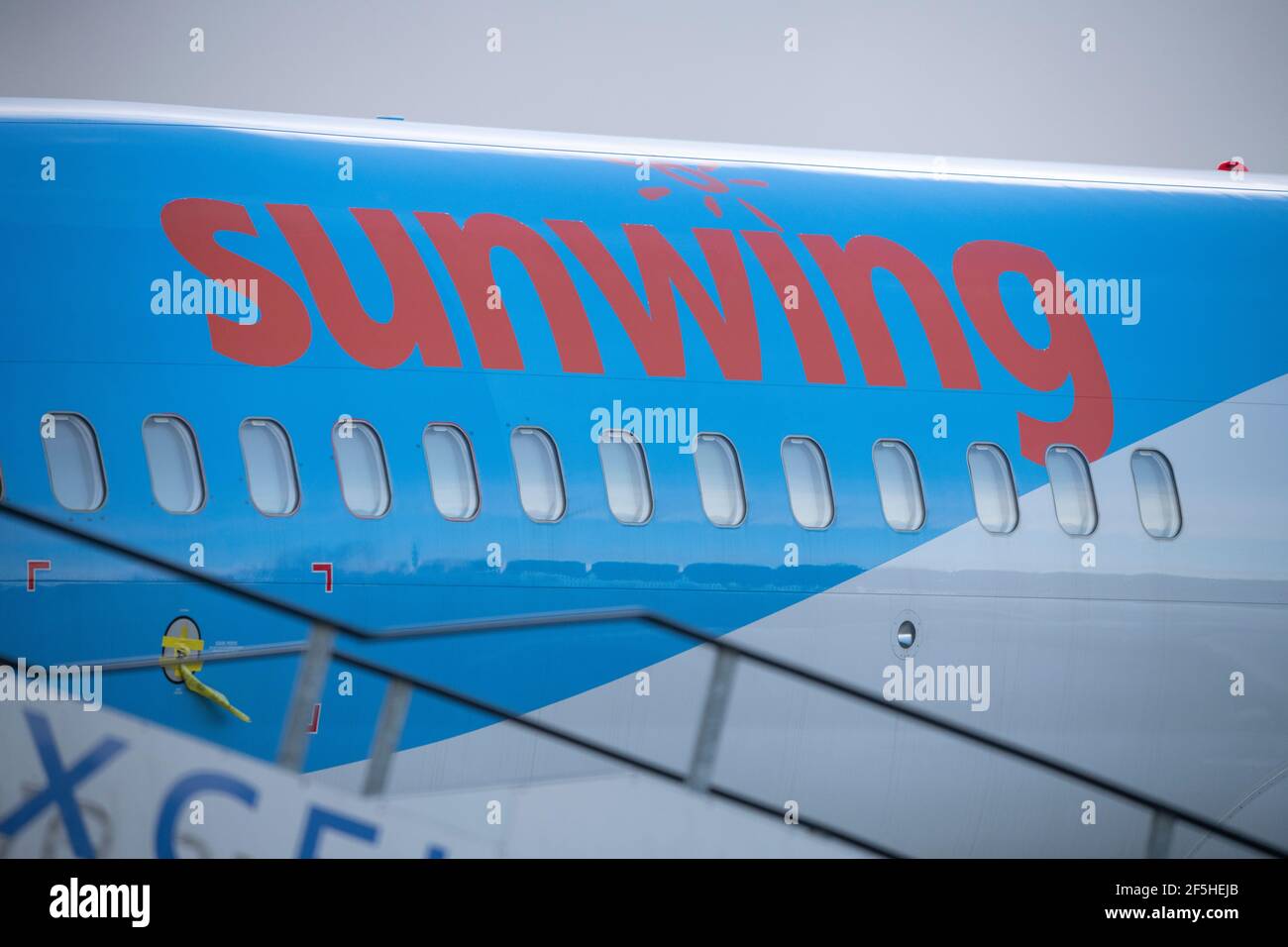 Glasgow, Scotland, UK. 26th Mar, 2021. PICTURED: Sunwing jet plane seen in Tui colours sits on the airport tarmac. Tui has reduced its capacity for this summer from 80% to 75% of 2019's level, with summer bookings appearing to have stalled, whilst operator Tui described bookings as “encouraging” at the group's annual general meeting (AGM) yesterday. The company reported group bookings for summer 2021 remain unchanged at 2.8 million, the same figure it reported in early February, leaving bookings 60% down on the comparable period in 2019. Credit: Colin Fisher/Alamy Live News Stock Photo