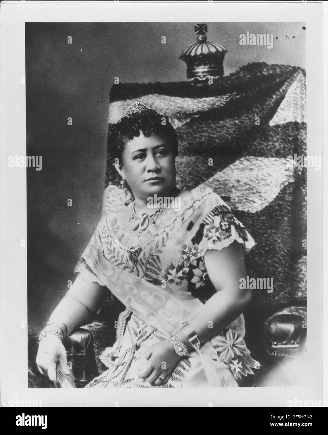 Queen Kapiolani on chair draped with feather cloak, retouched photo by