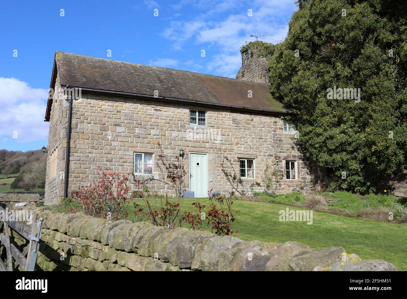 Eastwood Hall Cottage near Ashover which was built onto the historic ruins Stock Photo