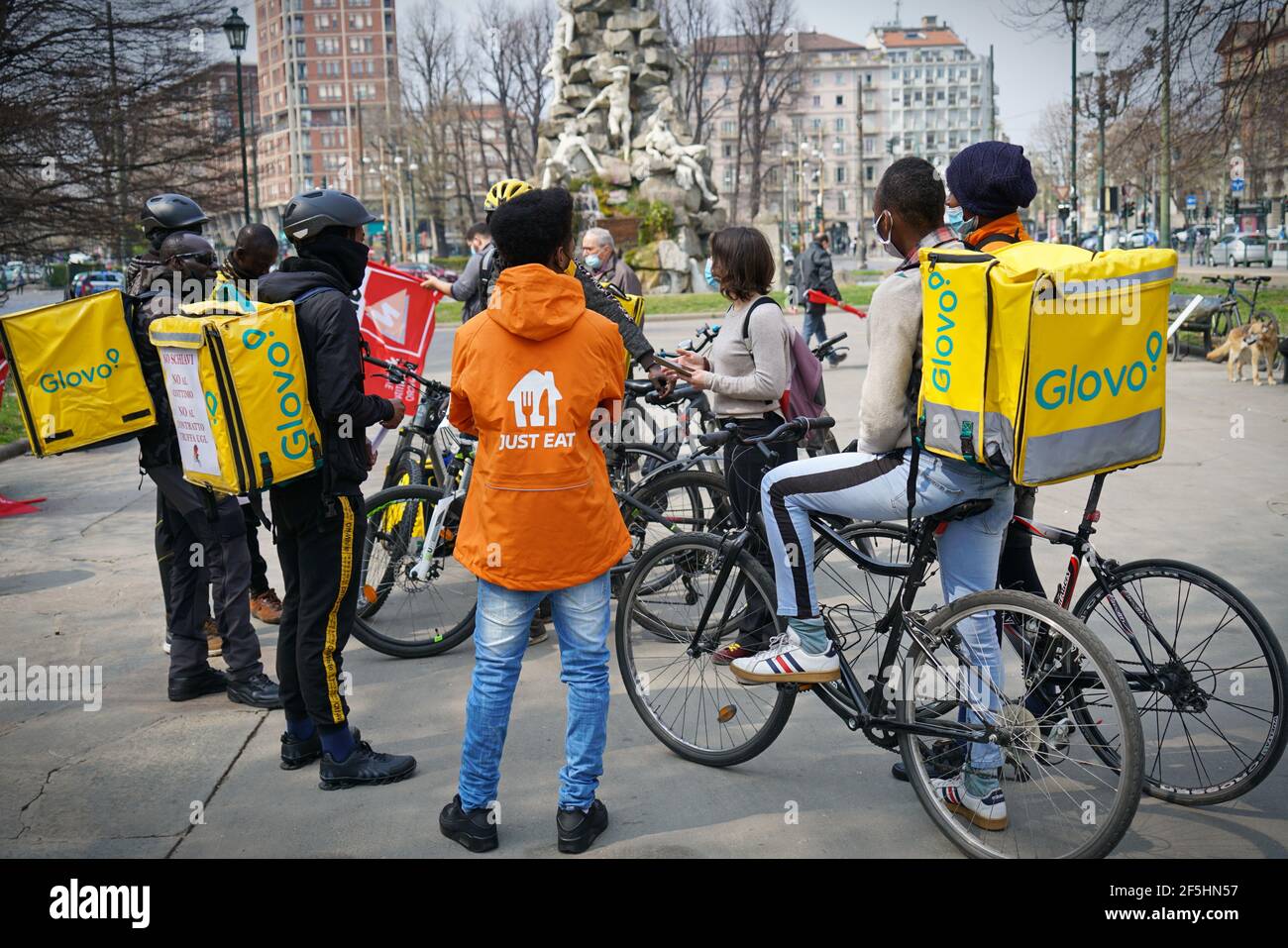 Bicycle food delivery riders protest against working conditions. Turin, Italy - March 2021 Stock Photo