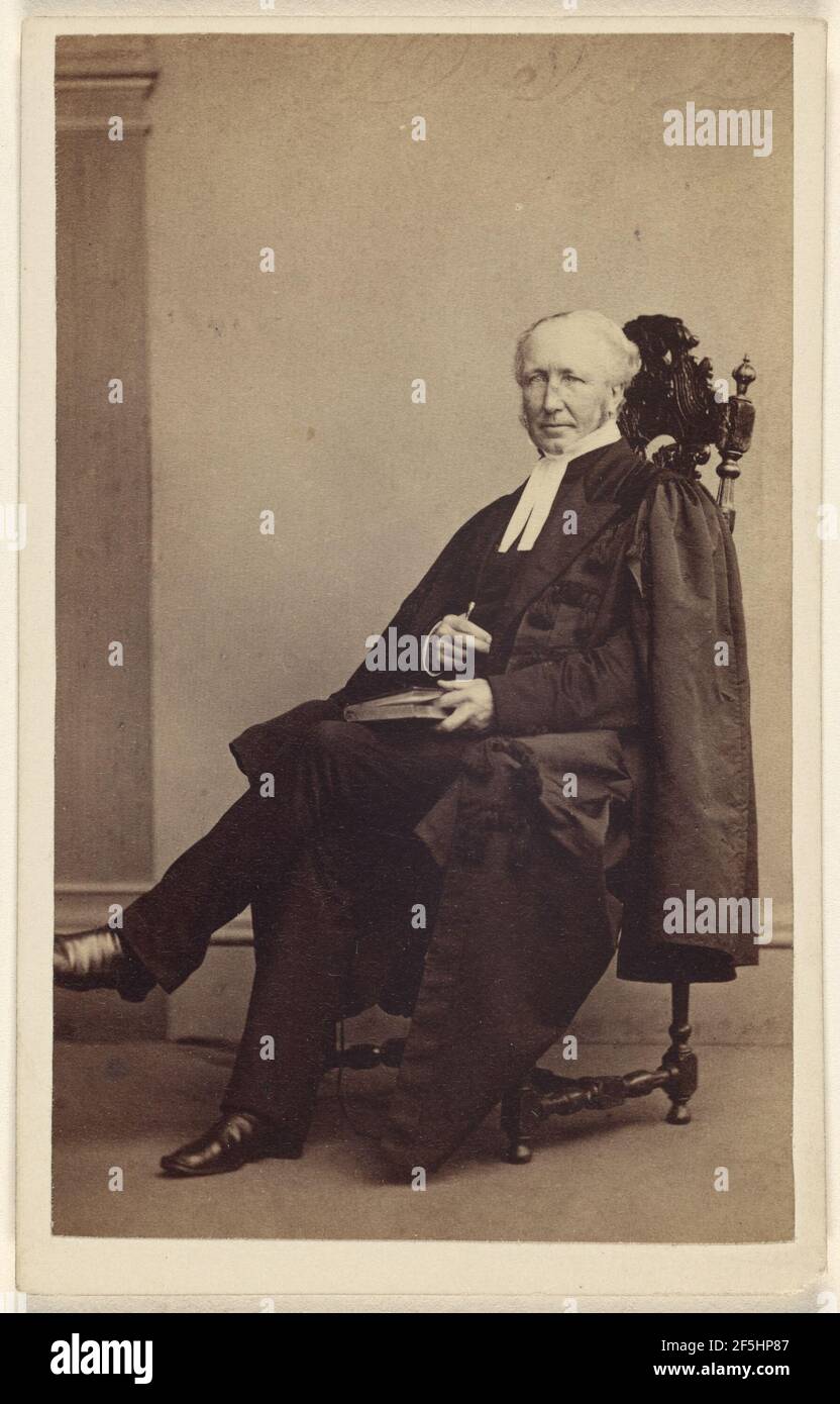 Unidentified elderly man seated with a book in his lap, finger holding its place. Thomas Rodger (Scottish, 1832 - 1883) Stock Photo