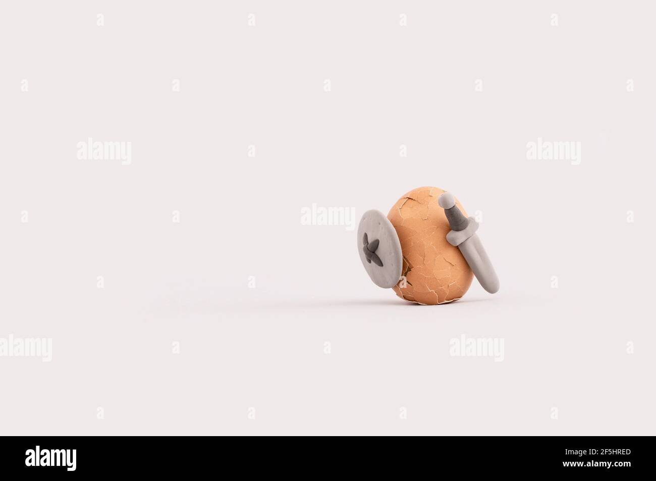 Easter egg having a sword fight with swords and shields Creative