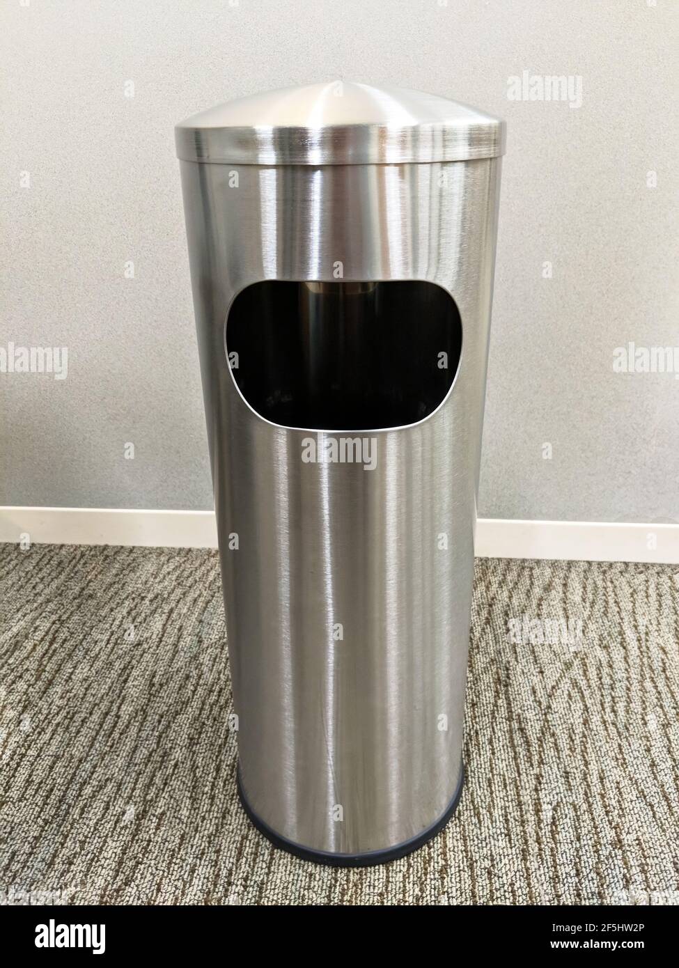 Modern brushed stainless steel trash can in office Stock Photo Alamy