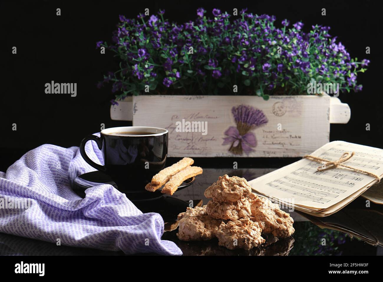 A morning cup of hot coffee with flowers and music. Stock Photo