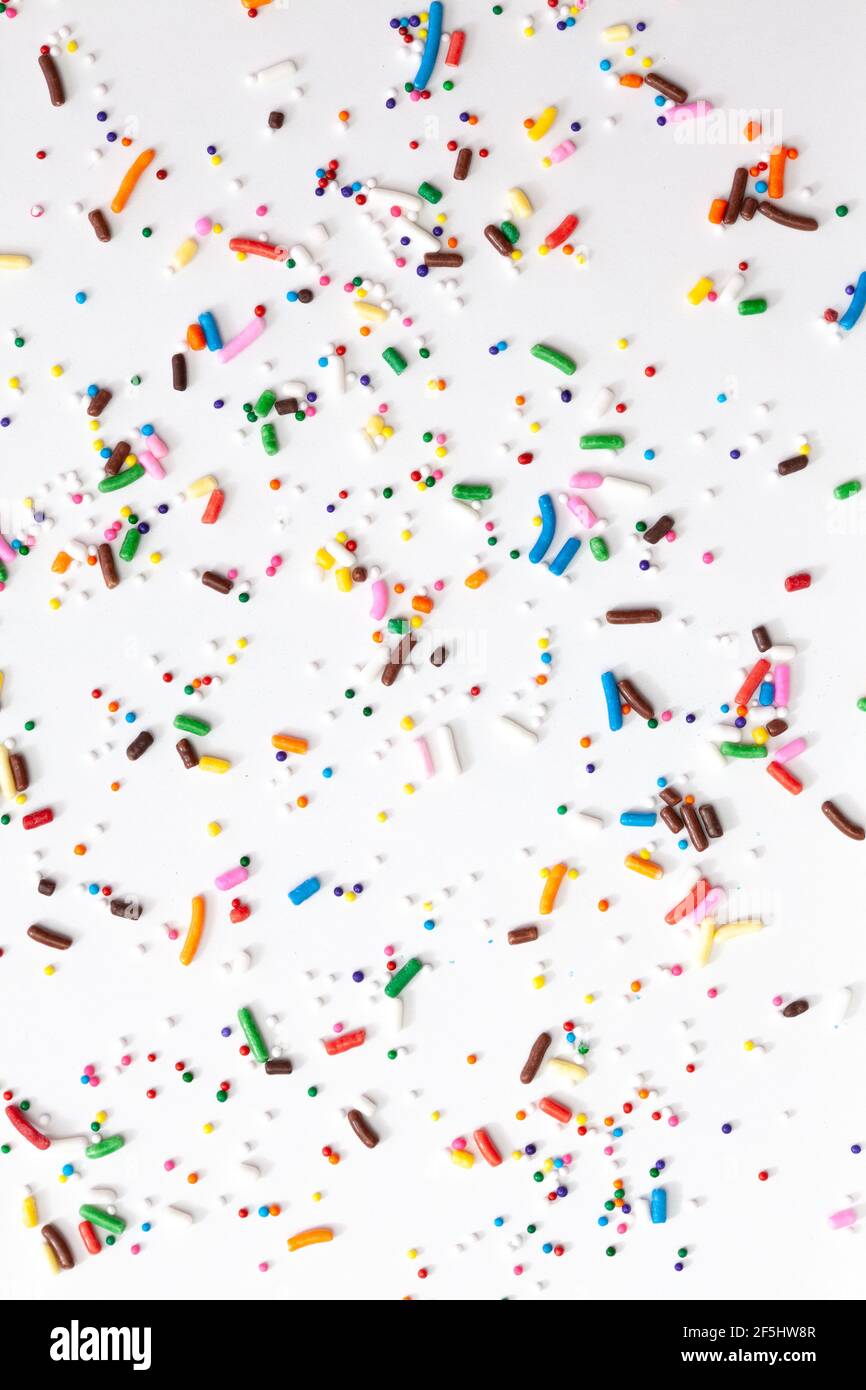 Colorful edible sugar sprinkles background - seamless pattern on white ...