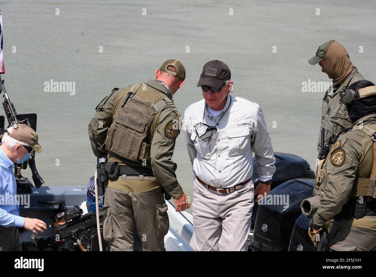 Granjeno, Texas USA, 26th Mar, 2021. Alabama Sen. TOMMY TUBERVILLE disembarks after a delegation of 18 Republican U.S. Senators rode on the Rio Grande River south of Mission in Texas Dept. of Public Safety gunboats at the end of a whirlwind tour of south Texas. The senators saw an overcrowded migrant processing center in Donna and a corpse floating in the river north of Anzalduas Park. Credit: Bob Daemmrich/Alamy Live News Stock Photo