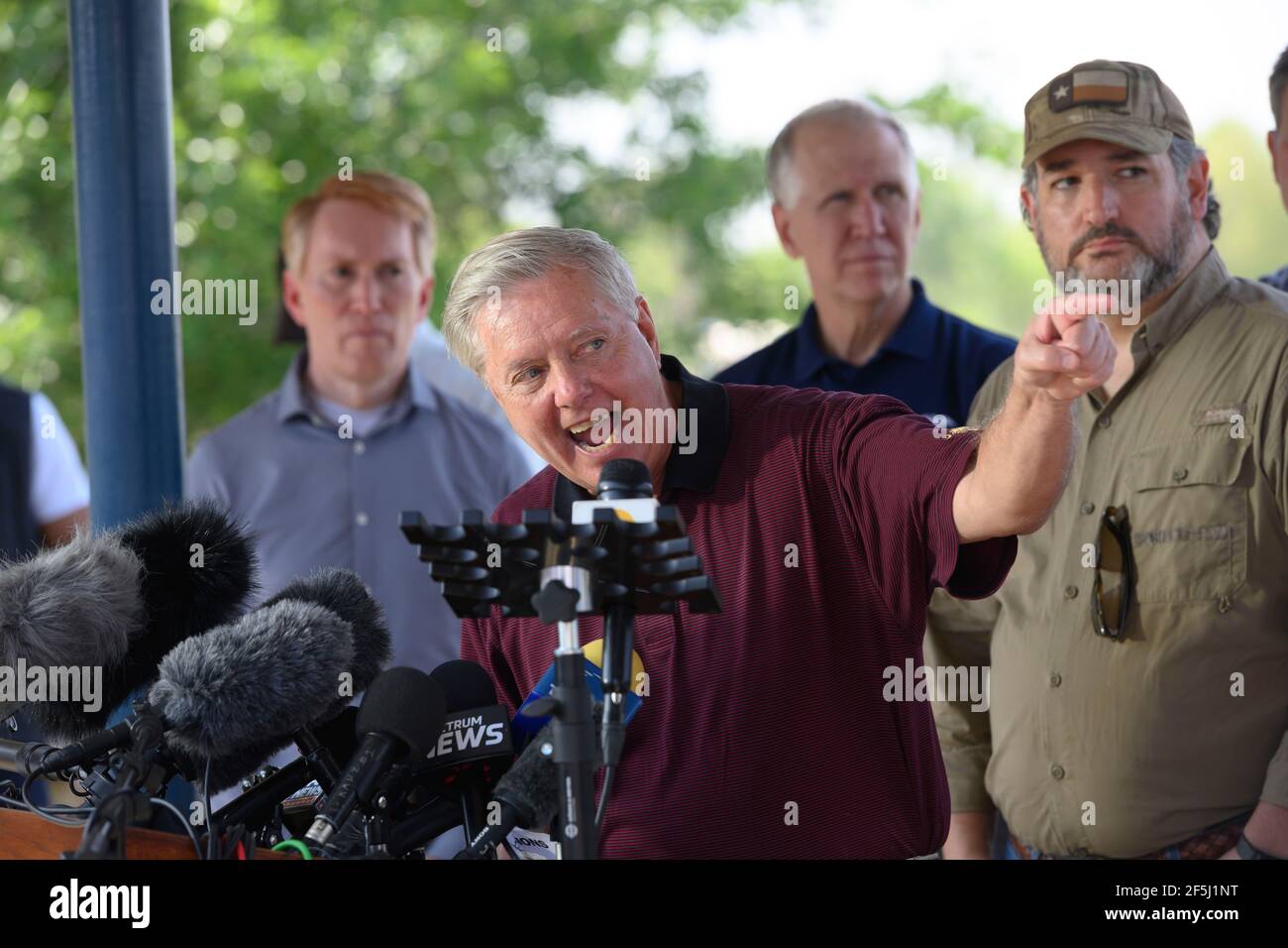 Granjeno, Texas, USA, 26th Mar, 2021. Sen. LINDSEY GRAHAM of South Carolina speaks to the media after 18 Republican U.S. Senators rode on the Rio Grande River south of Mission in four Texas Dept. of Public Safety gunboats at the end of a whirlwind tour of south Texas. The senators saw an overcrowded migrant processing center in Donna and a corpse floating in the river north of Anzalduas Park. Credit: Bob Daemmrich/Alamy Live News Stock Photo