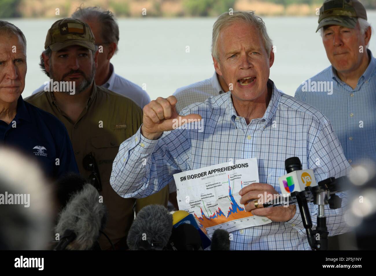 Granjeno, Texas, USA, 26th Mar, 2021. Sen. RON JOHNSON of Wisconsin speaks to the media after 18 Republican U.S. Senators rode on the Rio Grande River south of Mission in four Texas Dept. of Public Safety gunboats at the end of a whirlwind tour of south Texas. The senators saw an overcrowded migrant processing center in Donna and a corpse floating in the river north of Anzalduas Park. Credit: Bob Daemmrich/Alamy Live News Stock Photo