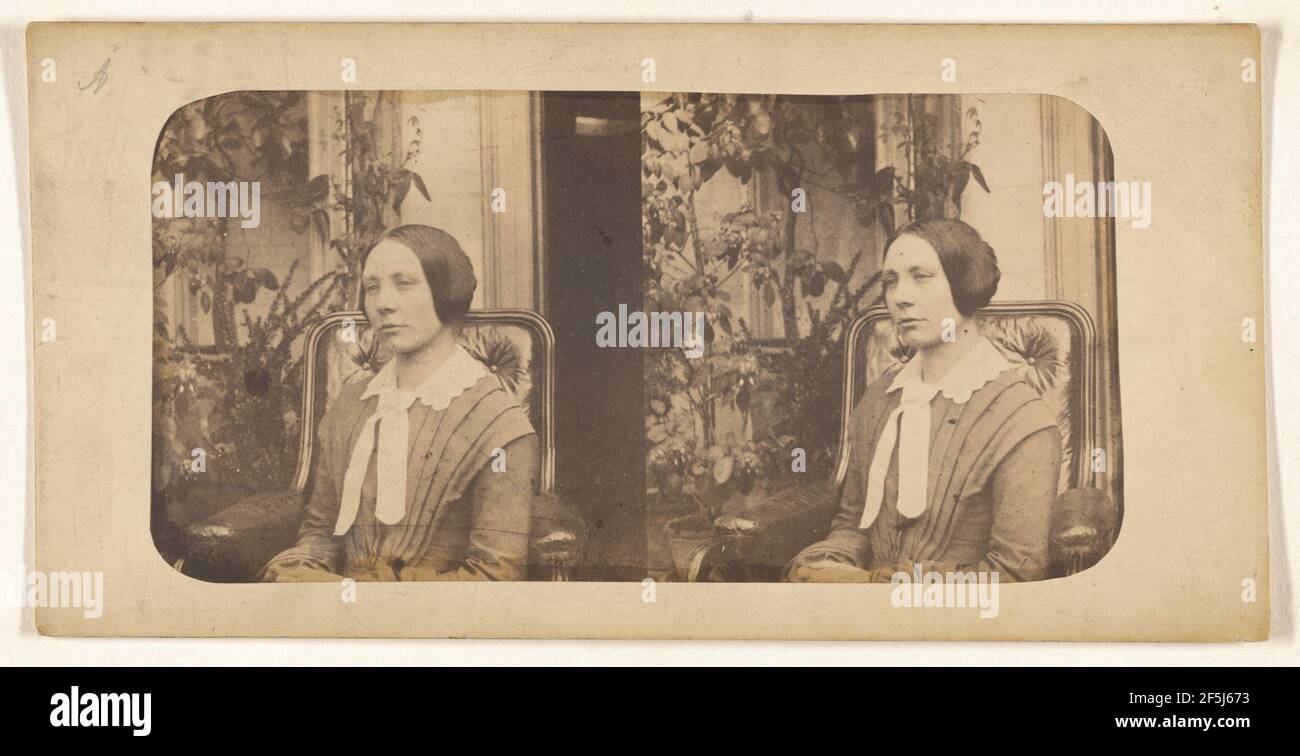 Woman with hair pulled back, seated. Unknown Stock Photo - Alamy