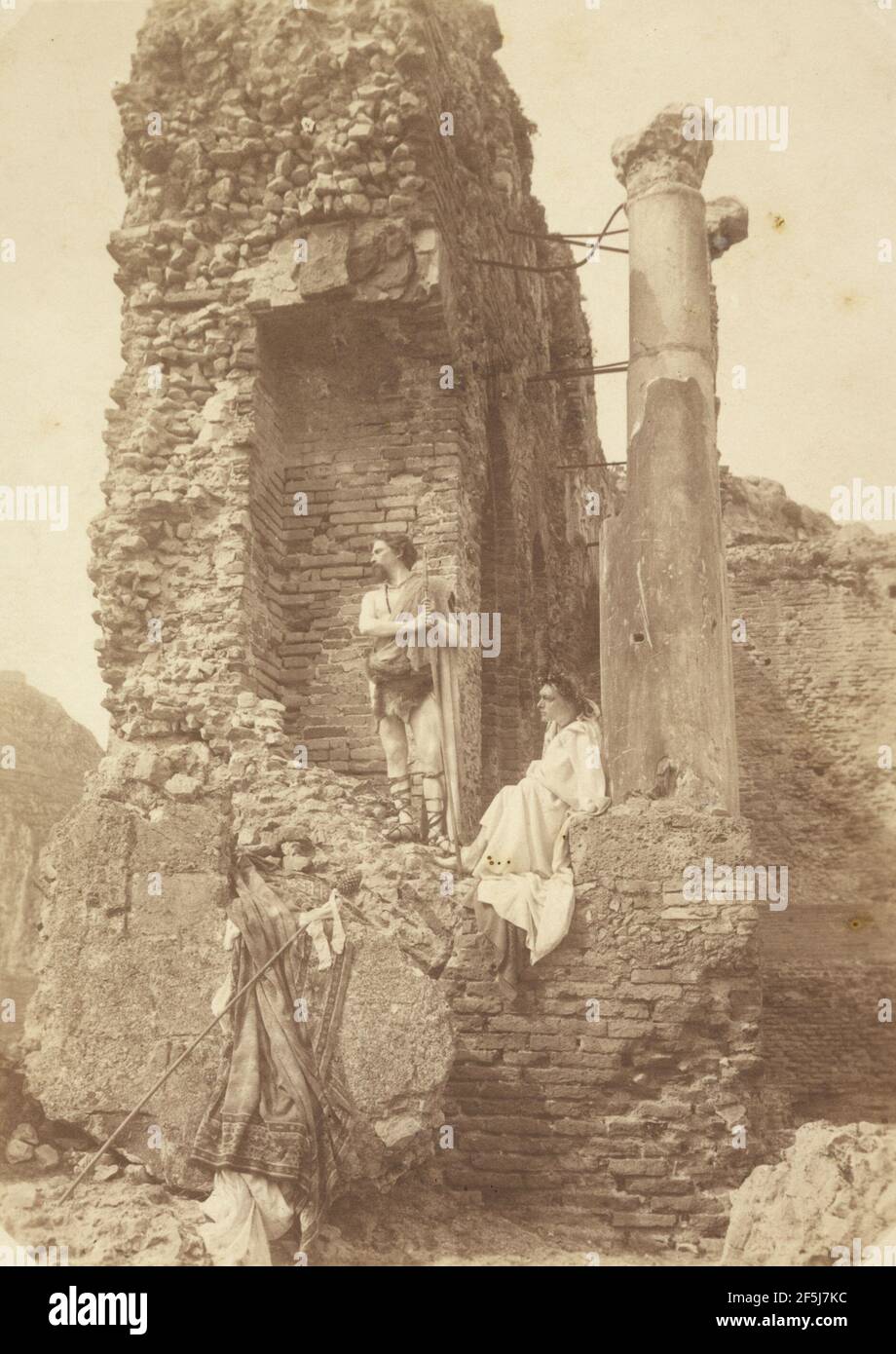 Two Men in costume near ruins. Baron Wilhelm von Gloeden (German, 1856 - 1931) Stock Photo