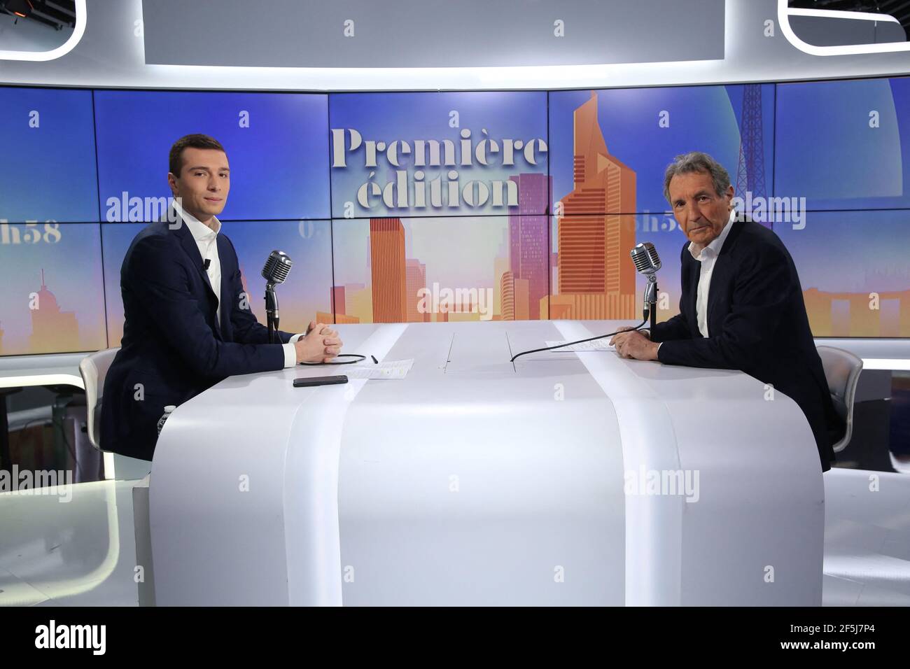 Jordan Bardella chats with journalist Jean-Jacques Bourdin at RMC/BFMTV  studios on March 26, 2021 in Paris, France. Photo by Jerome  Domine/ABACAPRESS.COM Stock Photo - Alamy