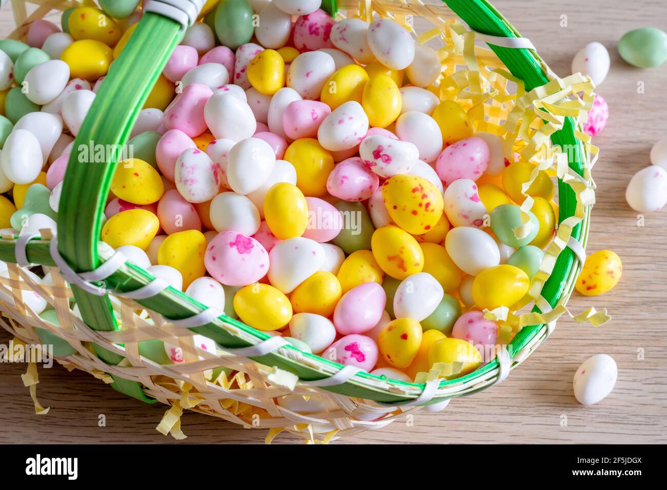 Easter. Basket filled with small sugar eggs Stock Photo