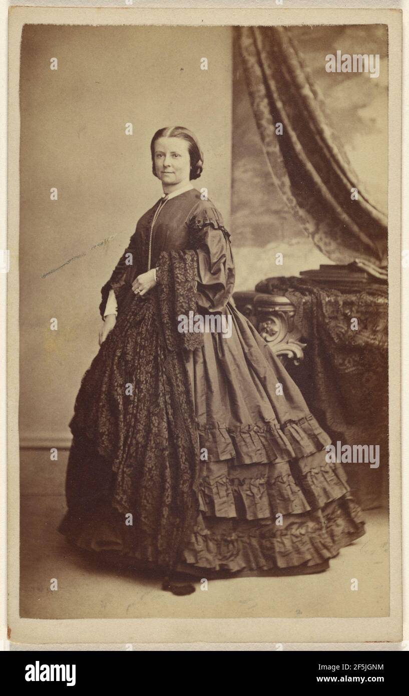 Unidentified woman wearing a long dark dress, standing. Thomas Rodger (Scottish, 1832 - 1883) Stock Photo